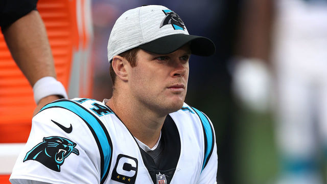 EAST RUTHERFORD, NEW JERSEY - OCTOBER 24: Sam Darnold #14 of the Carolina Panthers reacts on the bench during the second half in the game against the New York Giants at MetLife Stadium on October 24, 2021 in East Rutherford, New Jersey.