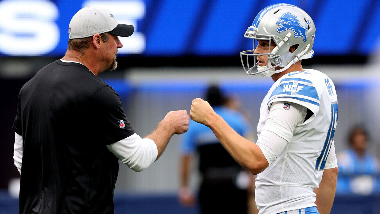 INGLEWOOD, CALIFORNIA - OCTOBER 24: Jared Goff #16 of the Detroit Lions talks to head coach Dan Campbell before the game against the Los Angeles Rams at SoFi Stadium on October 24, 2021 in Inglewood, California.