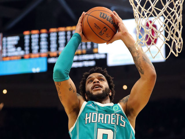 CLEVELAND, OH - OCTOBER 22: Miles Bridges #0 of the Charlotte Hornets grabs a rebound against the Cleveland Cavaliers on October 22, 2021 at Rocket Mortgage FieldHouse in Cleveland, Ohio. NOTE TO USER: User expressly acknowledges and agrees that, by downloading and/or using this Photograph, user is consenting to the terms and conditions of the Getty Images License Agreement. Mandatory Copyright Notice: Copyright 2021 NBAE