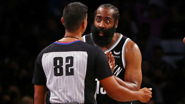 NEW YORK, NY - OCTOBER 24: James Harden #13 of the Brooklyn Nets has words with referee Suyash Mehta #82 during the second half of a game at Barclays Center on October 24, 2021 in New York City. The Hornets defeated the Nets 111-95.