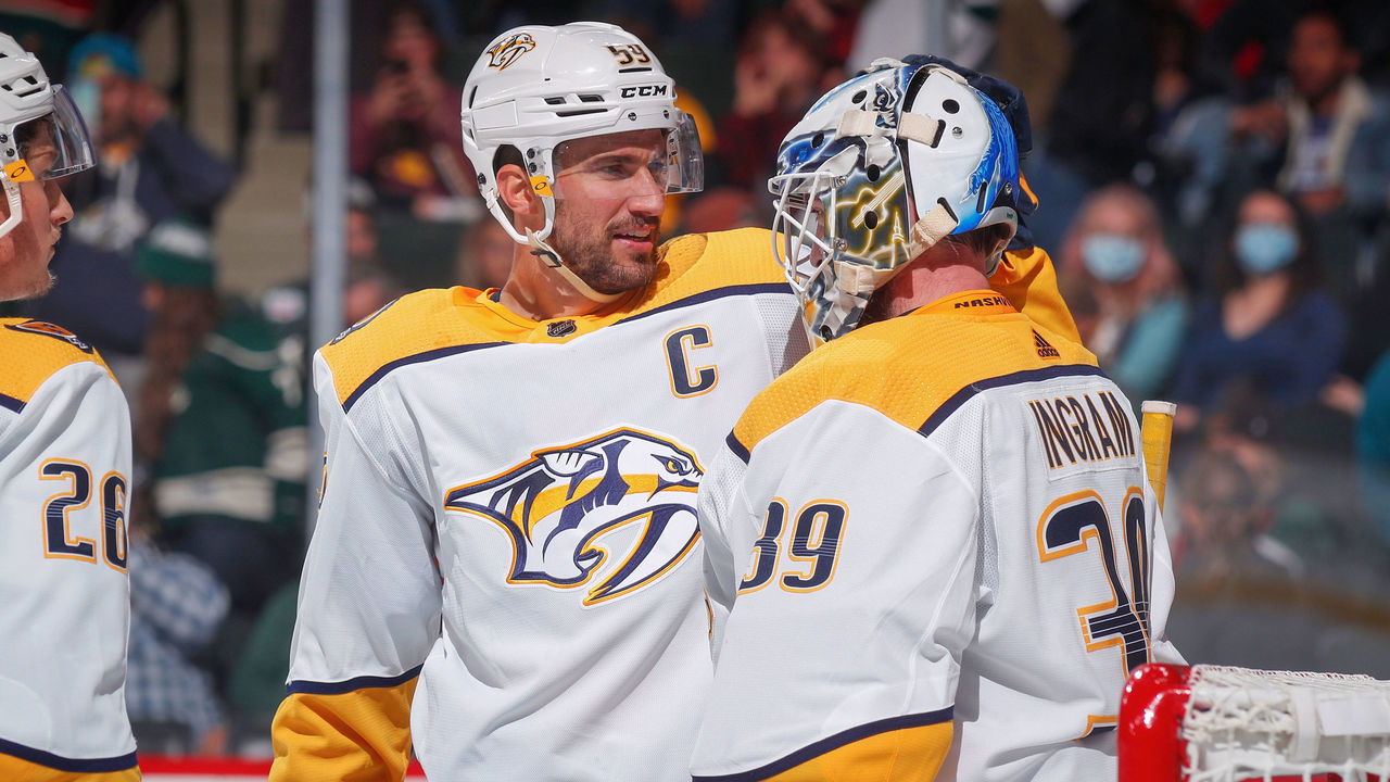 SAINT PAUL, MN - OCTOBER 24: Roman Josi #59 and Connor Ingram #39 of the Nashville Predators delebrate after defeating the Minnesota Wild at the Xcel Energy Center on October 24, 2021 in Saint Paul, Minnesota.
