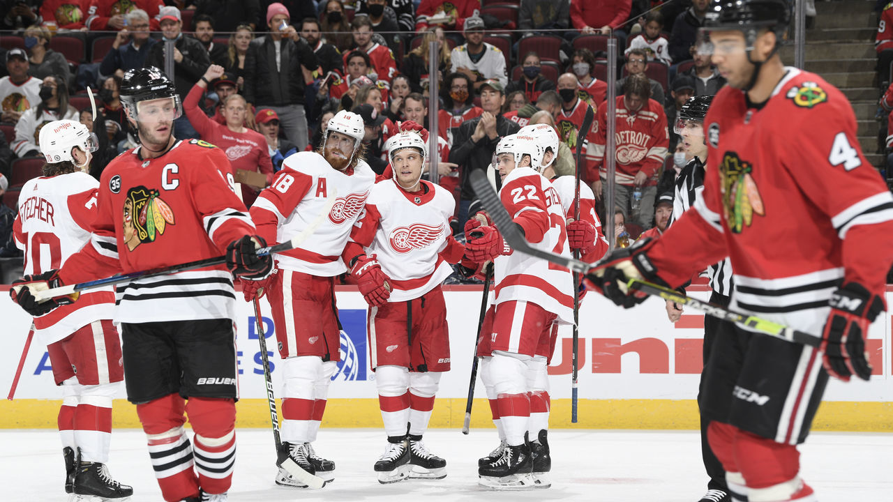 CHICAGO, ILLINOIS - OCTOBER 24: Vladislav Namestnikov #92 of the Detroit Red Wings celebrates with teammates, including Marc Staal #18 after scoring against the Chicago Blackhawks in the second period at United Center on October 24, 2021 in Chicago, Illinois.