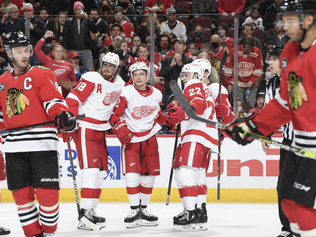 CHICAGO, ILLINOIS - OCTOBER 24: Vladislav Namestnikov #92 of the Detroit Red Wings celebrates with teammates, including Marc Staal #18 after scoring against the Chicago Blackhawks in the second period at United Center on October 24, 2021 in Chicago, Illinois.