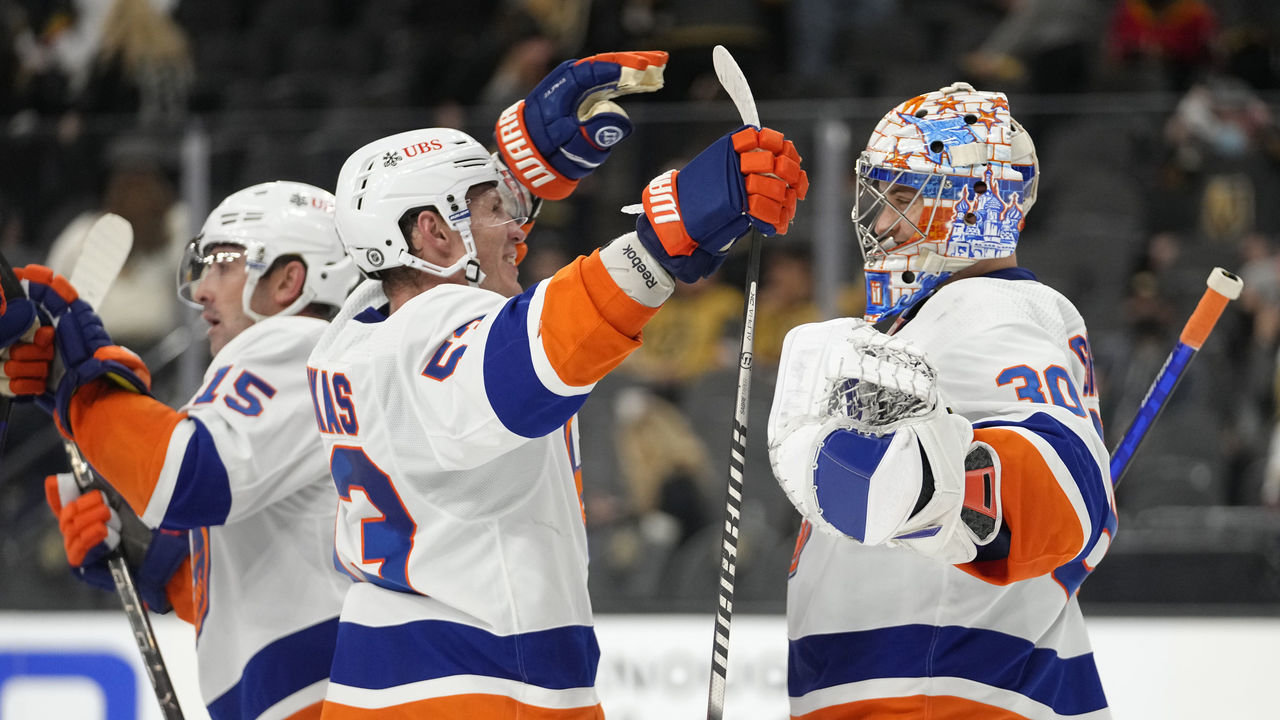 LAS VEGAS, NEVADA - OCTOBER 24: The New York Islanders celebrate after defeating the Vegas Golden Knights at T-Mobile Arena on October 24, 2021 in Las Vegas, Nevada.
