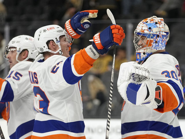 LAS VEGAS, NEVADA - OCTOBER 24: The New York Islanders celebrate after defeating the Vegas Golden Knights at T-Mobile Arena on October 24, 2021 in Las Vegas, Nevada.