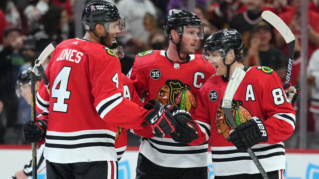 CHICAGO, IL - OCTOBER 09: Chicago Blackhawks center Jonathan Toews (19) celebrates with left wing Alex DeBrincat (12), right wing Patrick Kane (88) and defenseman Seth Jones (4) after scoring a goal during a preseason game between the Chicago Blackhawks and the Minnesota Wild on October 09, 2021 at the United Center in, Chicago, IL.