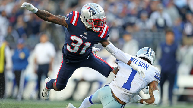 FOXBOROUGH, MASSACHUSETTS - OCTOBER 17: Ced Wilson #1 of the Dallas Cowboys makes a catch in front of Jonathan Jones #31 of the New England Patriots in the first quarter at Gillette Stadium on October 17, 2021 in Foxborough, Massachusetts.