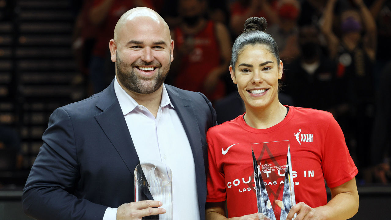 LAS VEGAS, NEVADA - SEPTEMBER 30: Las Vegas Aces General Manager of Basketball Operations Dan Padover (L), recipient of the 2021 WNBA Basketball Executive of the Year award, and Kelsey Plum #10 of the Las Vegas Aces, recipient of the WNBA's Sixth Player of the Year award, pose after receiving their awards before Game Two of the 2021 WNBA Playoffs semifinals between the Aces and the Phoenix Mercury at Michelob ULTRA Arena on September 30, 2021 in Las Vegas, Nevada.