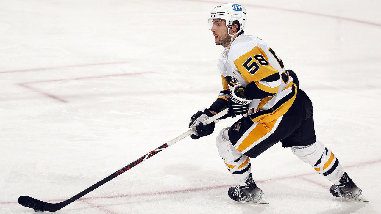 SUNRISE, FL - OCTOBER 14: Kris Letang #58 of the Pittsburgh Penguins skates with the puck against the Florida Panthers at the FLA Live Arena on October 14, 2021 in Sunrise, Florida.