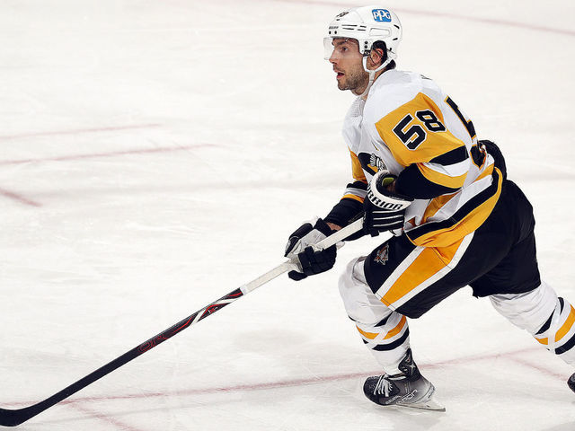 SUNRISE, FL - OCTOBER 14: Kris Letang #58 of the Pittsburgh Penguins skates with the puck against the Florida Panthers at the FLA Live Arena on October 14, 2021 in Sunrise, Florida.
