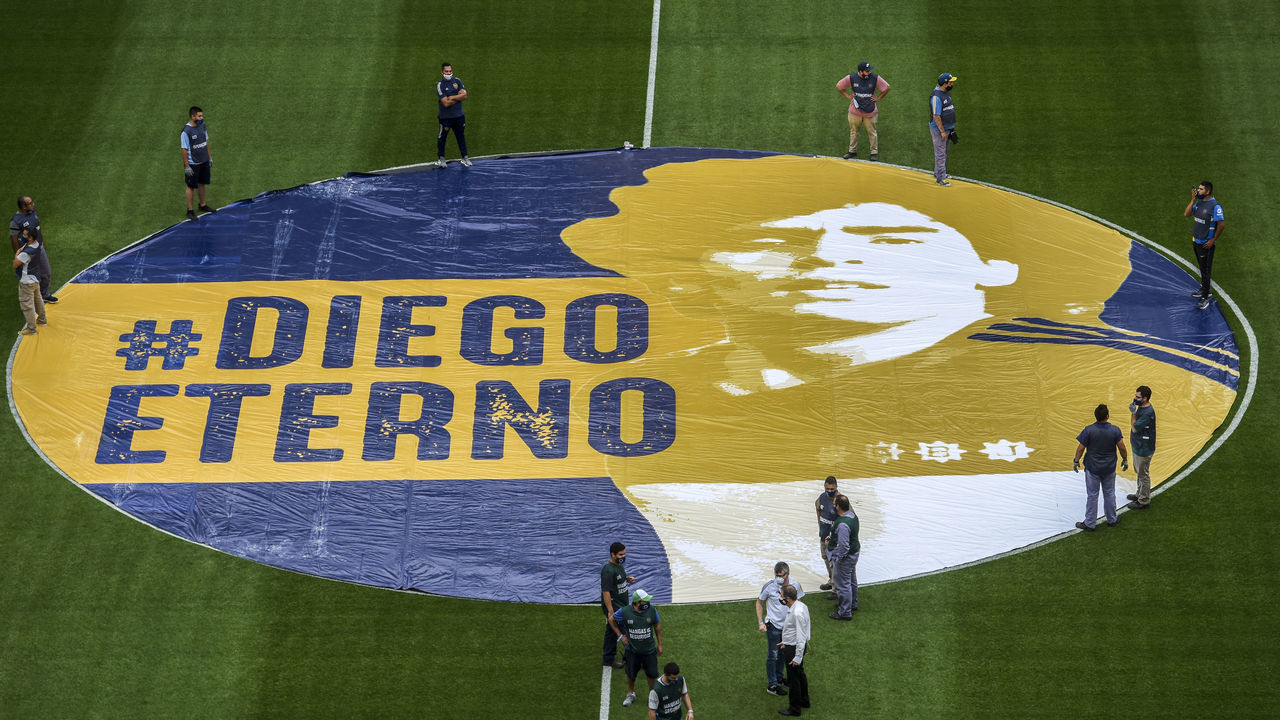BUENOS AIRES, ARGENTINA - NOVEMBER 29: A banner with the phrase '#DiegoEterno' in tribute to the late Argentine football legend Diego Maradona is displayed before a match between Boca Juniors and Newell's Old Boys as part of Copa Diego Maradona 2020 at Estadio Alberto J. Armando on November 29, 2020 in Buenos Aires, Argentina. Argentine football tournament was renamed to honour the late Diego Maradona.