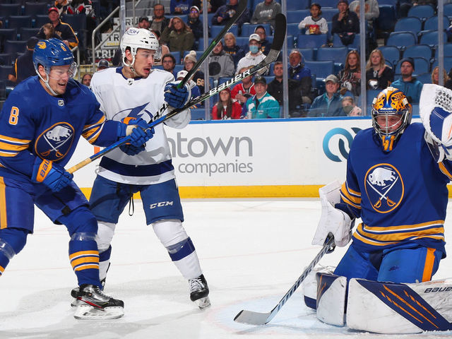 BUFFALO, NY - OCTOBER 25: Craig Anderson #41 makes a save as Robert Hagg #8 of the Buffalo Sabres defends against Alex Barré-Boulet #12 of the Tampa Bay Lightning during an NHL game on October 25, 2021 at KeyBank Center in Buffalo, New York.