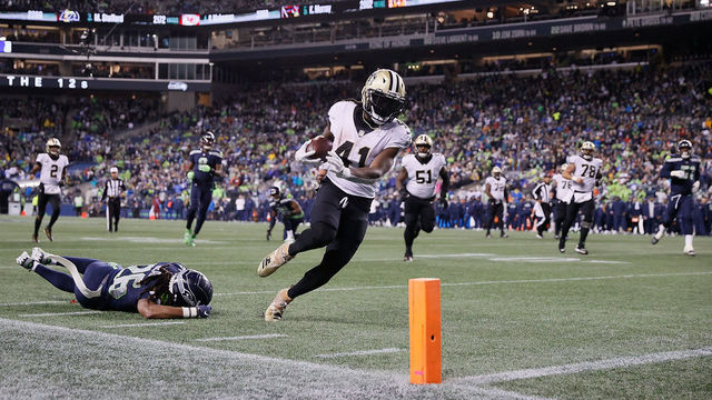 SEATTLE, WASHINGTON - OCTOBER 25: Alvin Kamara #41 of the New Orleans Saints catches a pass for a touchdown during the first half against the Seattle Seahawks at Lumen Field on October 25, 2021 in Seattle, Washington.
