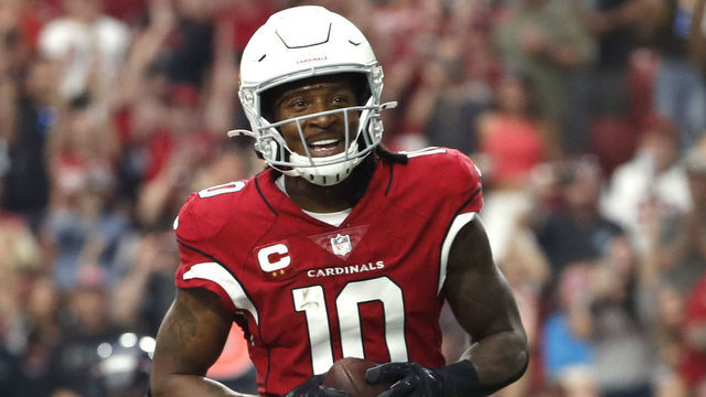 GLENDALE, ARIZONA - OCTOBER 24: DeAndre Hopkins #10 of the Arizona Cardinals celebrates after scoring a touchdown in the second quarter against the Houston Texans in the game at State Farm Stadium on October 24, 2021 in Glendale, Arizona.