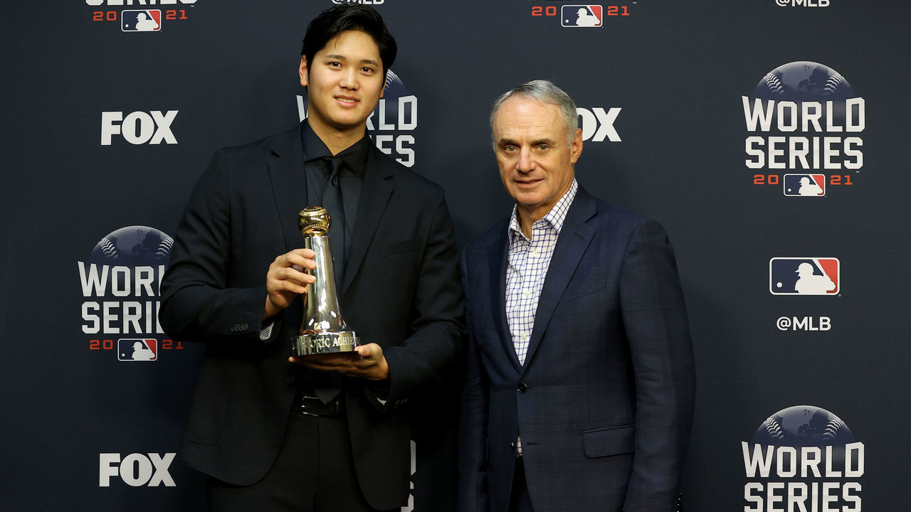 HOUSTON, TEXAS - OCTOBER 26: Major League Baseball Commissioner Rob Manfred presents Shohei Ohtani of the Los Angeles Angels with the Commissioner's Historic Achievement Award prior to Game One of the World Series between the Atlanta Braves and the Houston Astros at Minute Maid Park on October 26, 2021 in Houston, Texas.