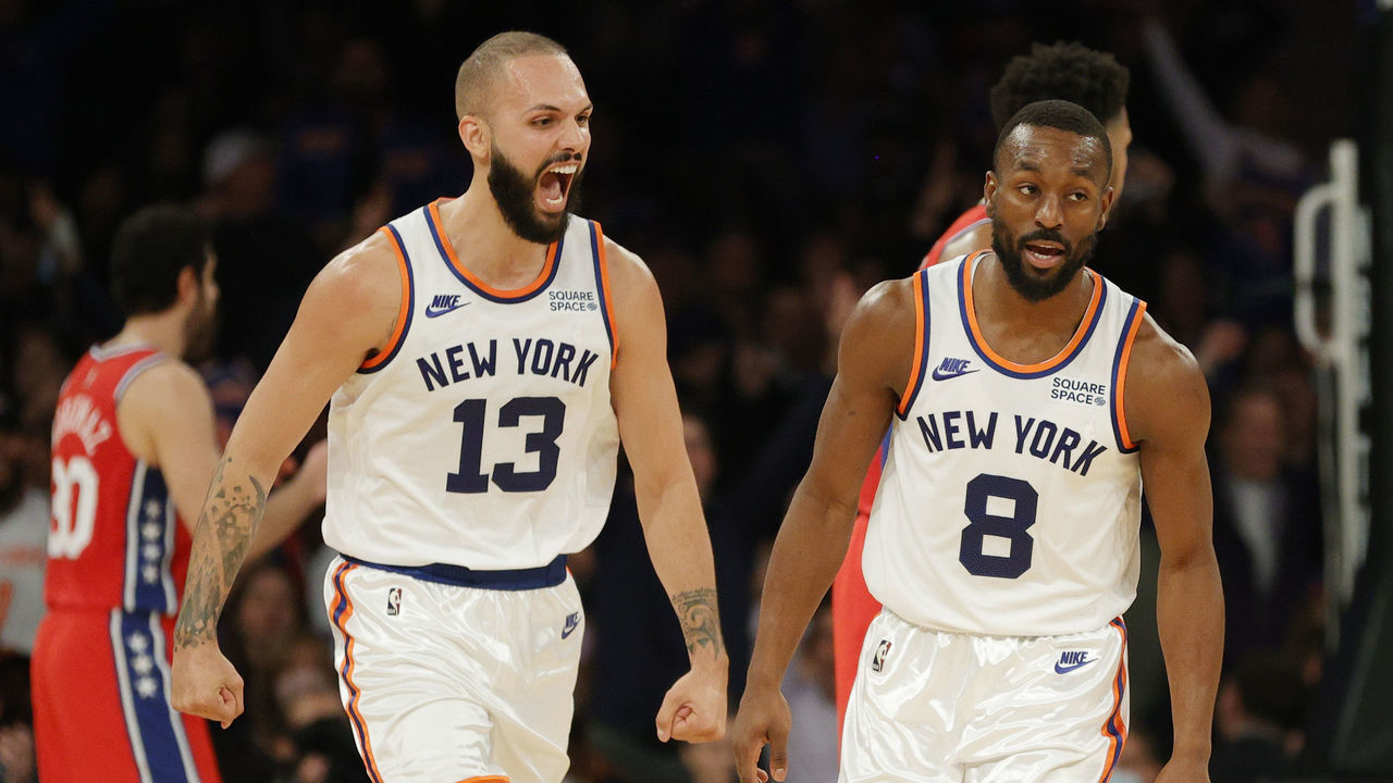 NEW YORK, NEW YORK - OCTOBER 26: Evan Fournier #13 reacts with Kemba Walker #8 of the New York Knicks during the first half against the Philadelphia 76ers at Madison Square Garden on October 26, 2021 in New York City.