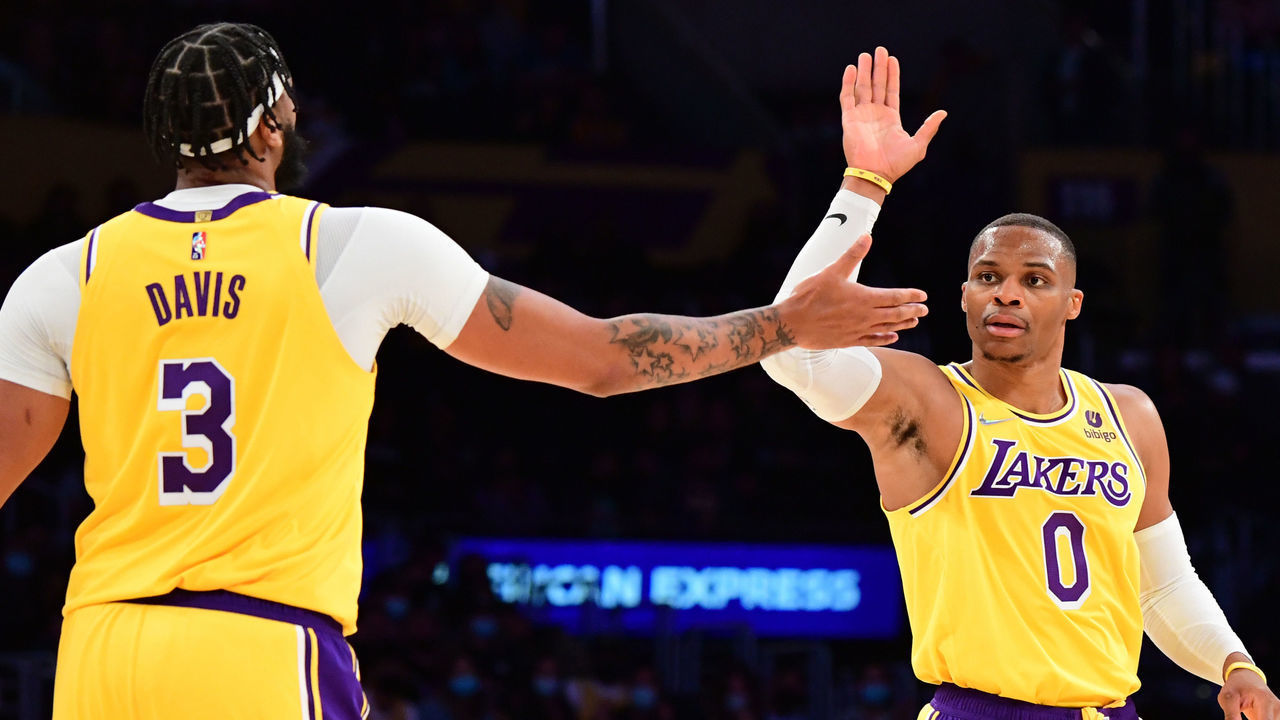 LOS ANGELES, CA - OCTOBER 12: Russell Westbrook #0 of the Los Angeles Lakers high-fives teammate Anthony Davis #3 during a preseason game against the Golden State Warriors on October 12, 2021 at STAPLES Center in Los Angeles, California. NOTE TO USER: User expressly acknowledges and agrees that, by downloading and/or using this Photograph, user is consenting to the terms and conditions of the Getty Images License Agreement. Mandatory Copyright Notice: Copyright 2021 NBAE
