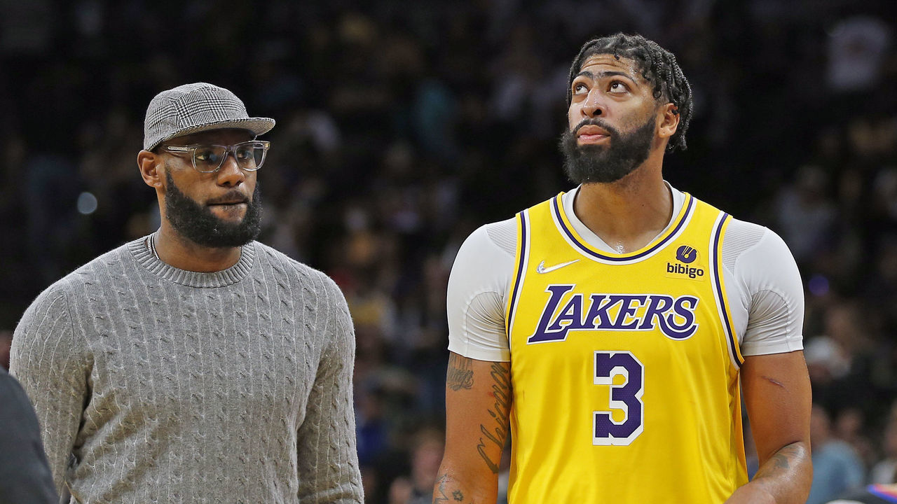 SAN ANTONIO, TX - OCTOBER 26: LeBron James of the Los Angeles Lakers who sat out the game checks on teammate Anthony Davis #3 after Davis was injured in the fourth quarter at AT&T Center on October 26, 2021 in San Antonio, Texas. The Lakers won 125-121 in overtime. NOTE TO USER: User expressly acknowledges and agrees that , by downloading and or using this photograph, User is consenting to the terms and conditions of the Getty Images License Agreement.