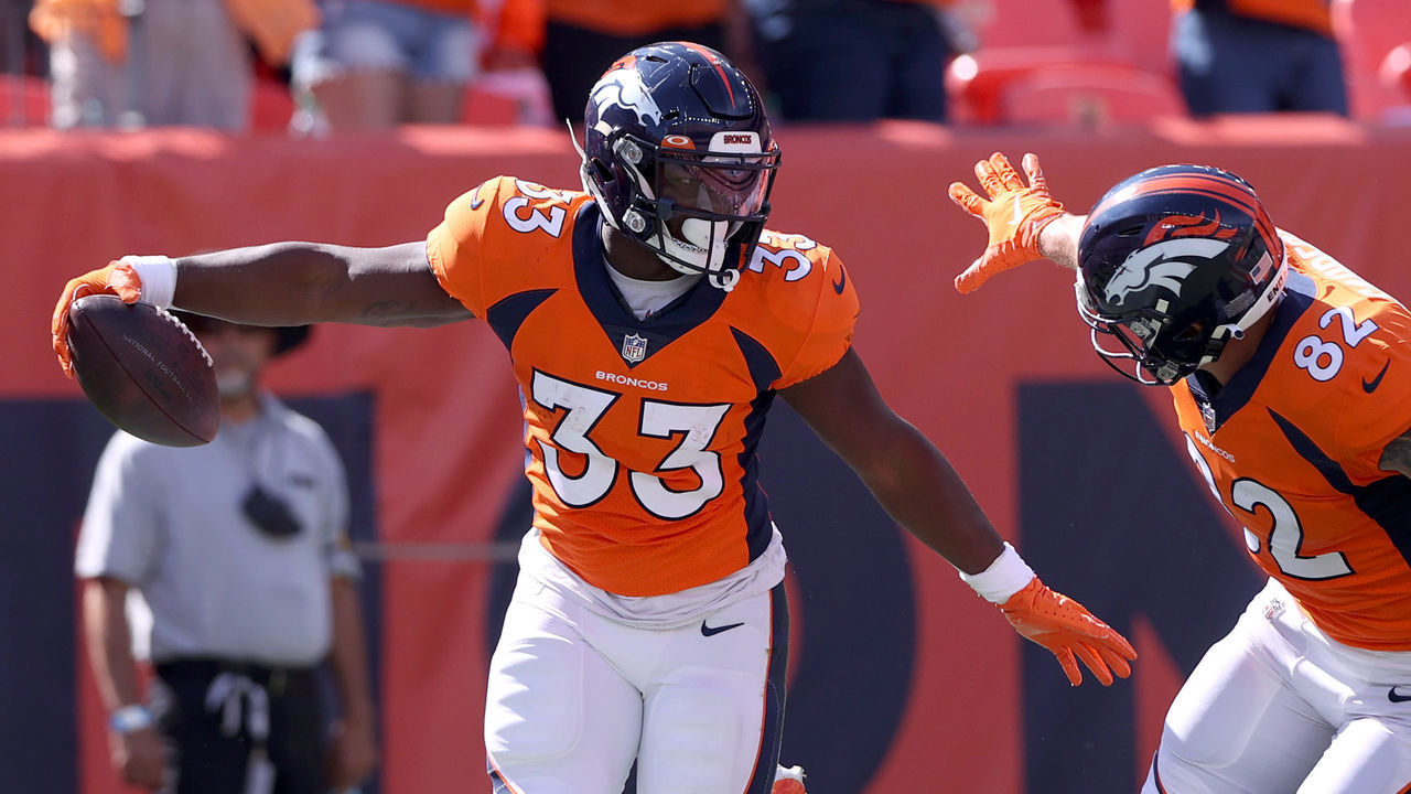 DENVER, COLORADO - SEPTEMBER 26: Javonte Williams #33 of the Denver Broncos celebrates scoring a touchdown with Eric Saubert #82 against the New York Jets at Empower Field At Mile High on September 26, 2021 in Denver, Colorado.