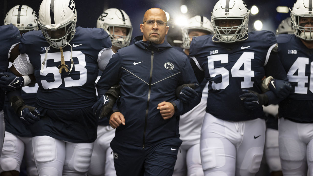 STATE COLLEGE, PA - OCTOBER 23: Head coach James Franklin of the Penn State Nittany Lions leads the team onto the field before the game against the Illinois Fighting Illini at Beaver Stadium on October 23, 2021 in State College, Pennsylvania.
