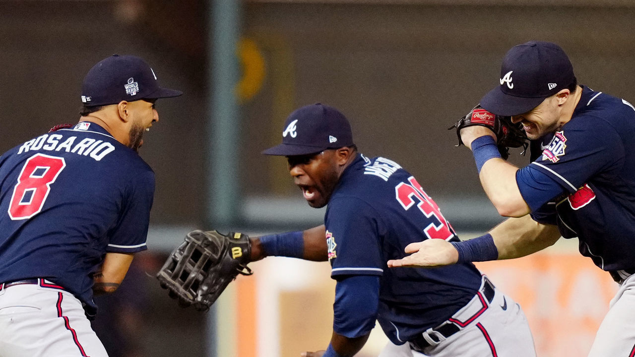 HOUSTON, TX - OCTOBER 26: Eddie Rosario #8, Guillermo Heredia #38 and Adam Duvall #14 of the Atlanta Braves celebrate after the Braves defeated the Houston Astros in Game 1 of the 2021 World Series at Minute Maid Park on Tuesday, October 26, 2021 in Houston, Texas.