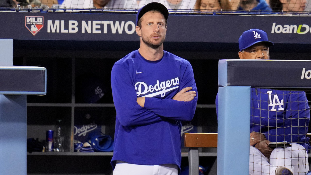 Los Angeles, CA - October 20: Max Scherzer #31 of the Los Angeles Dodgers stands at the top of the steps to watch the Atlanta Braves during the fourth inning of game 4 of the baseball National League Championship Series at Dodger Stadium on Wednesday, October 20, 2021, in Los Angeles.