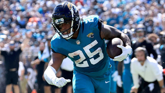 JACKSONVILLE, FLORIDA - OCTOBER 10: James Robinson #25 of the Jacksonville Jaguars rushes for a touchdown during the game against the Tennessee Titans at TIAA Bank Field on October 10, 2021 in Jacksonville, Florida.
