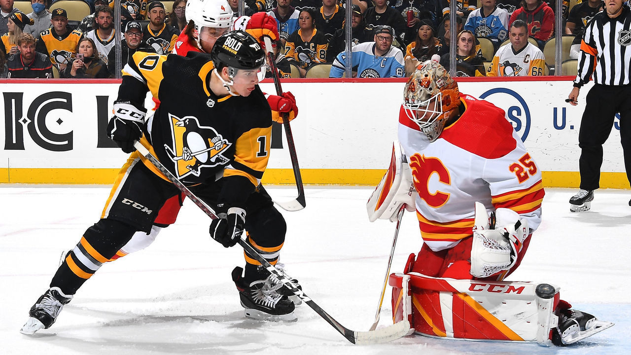PITTSBURGH, PA - OCTOBER 28: Jacob Markstrom #25 of the Calgary Flames makes a save against Drew O'Connor #10 of the Pittsburgh Penguins at PPG PAINTS Arena on October 28, 2021 in Pittsburgh, Pennsylvania.