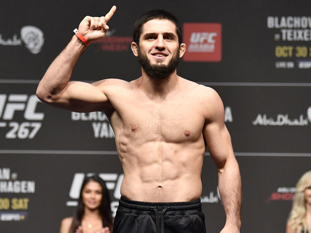ABU DHABI, UNITED ARAB EMIRATES - OCTOBER 29: Islam Makhachev of Russia poses on the scale during the UFC 267 ceremonial weigh-in at Etihad Arena on October 29, 2021 in Yas Island, Abu Dhabi, United Arab Emirates.