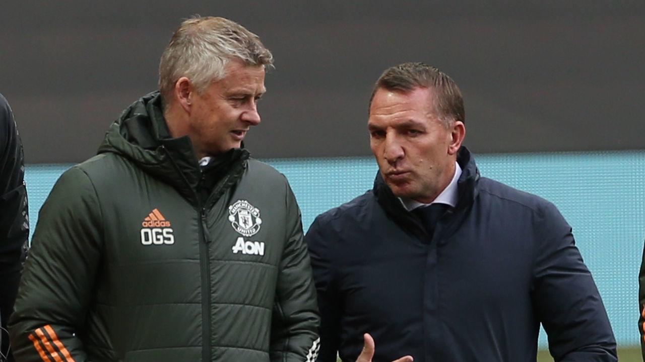 MANCHESTER, ENGLAND - MAY 11: Manager Ole Gunnar Solskjaer of Manchester United walks out with Manager Brendan Rodgers of Leicester City ahead of the Premier League match between Manchester United and Leicester City at Old Trafford on May 11, 2021 in Manchester, England. Sporting stadiums around the UK remain under strict restrictions due to the Coronavirus Pandemic as Government social distancing laws prohibit fans inside venues resulting in games being played behind closed doors.