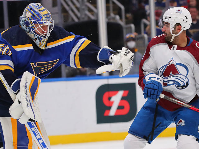ST LOUIS, MO - OCTOBER 28: Jordan Binnington #50 of the St. Louis Blues makes a save against Nazem Kadri #91 of the Colorado Avalanche in the first period at Enterprise Center on October 28, 2021 in St Louis, Missouri.