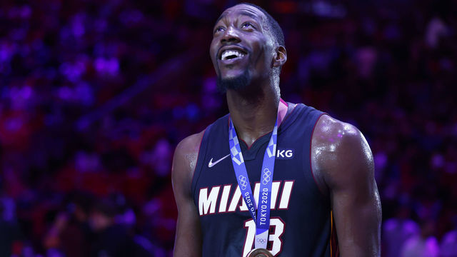 MIAMI, FLORIDA - OCTOBER 29: Bam Adebayo #13 of the Miami Heat looks on as he is recognized for winning the gold medal at the 2020 Tokyo Olympics at halftime against the Charlotte Hornets at FTX Arena on October 29, 2021 in Miami, Florida.