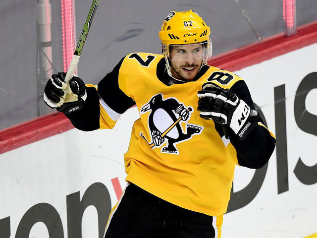 PITTSBURGH, PENNSYLVANIA - MAY 24: Sidney Crosby #87 of the Pittsburgh Penguins celebrates a goal by teammate Bryan Rust #17 against the New York Islanders during the second period in Game Five of the First Round of the 2021 Stanley Cup Playoffs at PPG PAINTS Arena on May 24, 2021 in Pittsburgh, Pennsylvania.