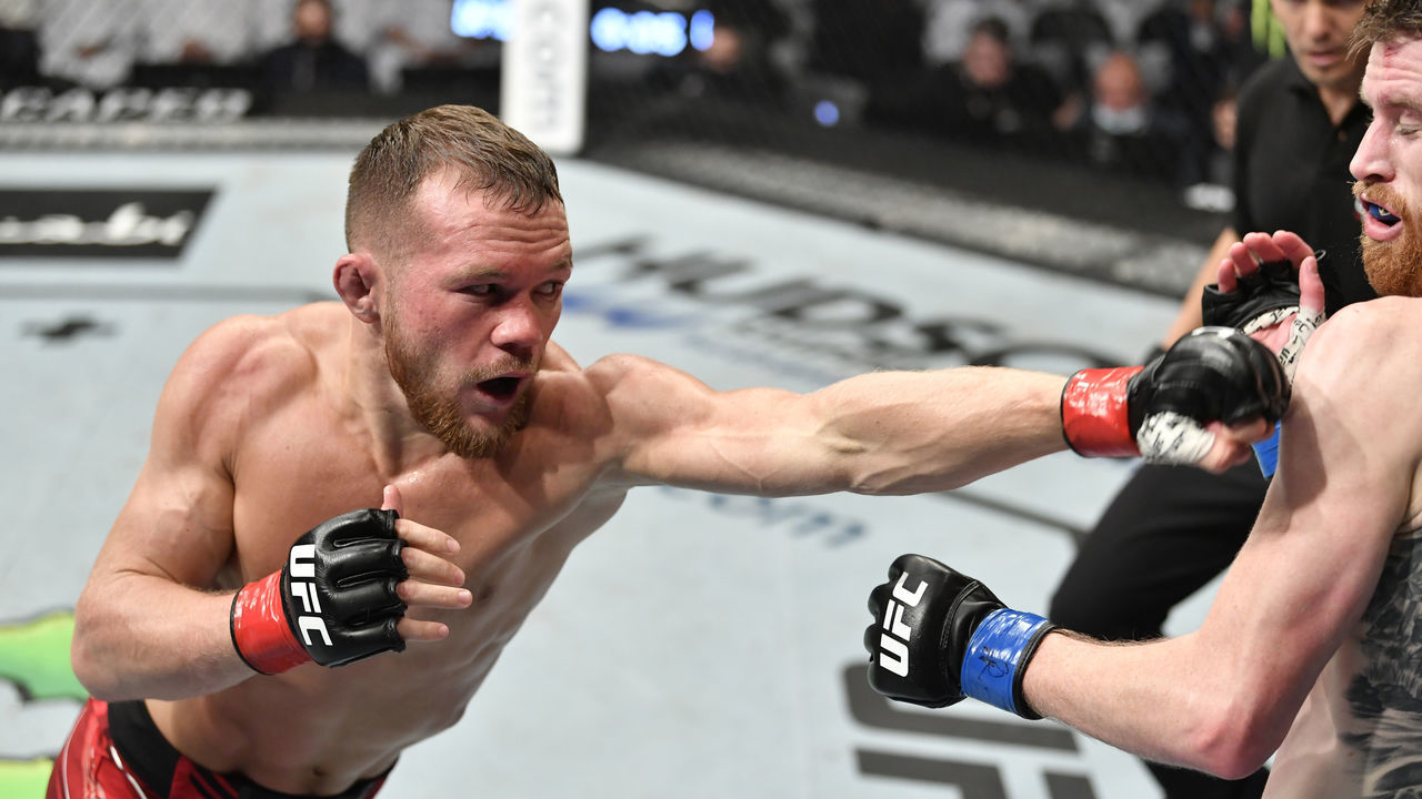 ABU DHABI, UNITED ARAB EMIRATES - OCTOBER 30: (L-R) Petr Yan of Russia punches Cory Sandhagen in the UFC interim bantamweight championship fight during the UFC 267 event at Etihad Arena on October 30, 2021 in Yas Island, Abu Dhabi, United Arab Emirates.