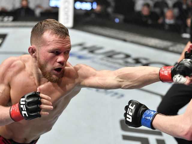 ABU DHABI, UNITED ARAB EMIRATES - OCTOBER 30: (L-R) Petr Yan of Russia punches Cory Sandhagen in the UFC interim bantamweight championship fight during the UFC 267 event at Etihad Arena on October 30, 2021 in Yas Island, Abu Dhabi, United Arab Emirates.