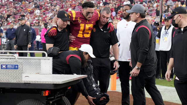 Los Angeles, CA - October 30: Wide receiver Drake London #15 of the USC Trojans is carted off after an injury on a touchdown catch against the Arizona Wildcats in the first half of a NCAA football game at the Los Angeles Memorial Coliseum in Los Angeles on Saturday, October 30, 2021.