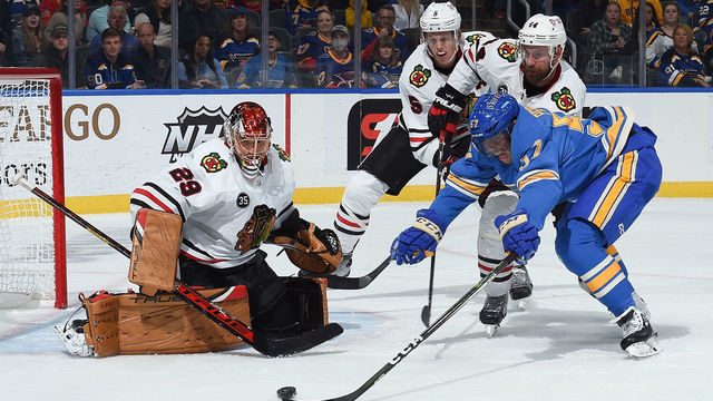 ST. LOUIS, MO - OCTOBER 30: Marc-Andre Fleury #29 Connor Murphy #5 and Calvin de Haan #44 of the Chicago Blackhawks defend the net against David Perron #57 of the St. Louis Blues at the Enterprise Center on October 30, 2021 in St. Louis, Missouri.