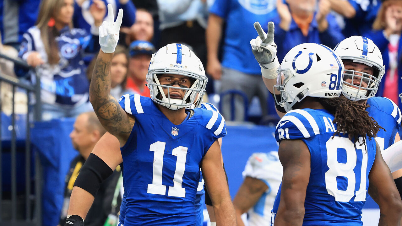 INDIANAPOLIS, INDIANA - OCTOBER 31: The Indianapolis Colts celebrate a touchdown by Michael Pittman #11 in the first half against the Tennessee Titans at Lucas Oil Stadium on October 31, 2021 in Indianapolis, Indiana.