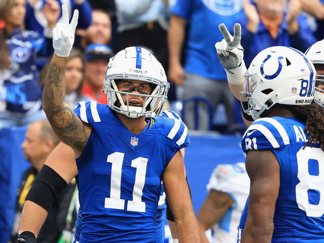 INDIANAPOLIS, INDIANA - OCTOBER 31: The Indianapolis Colts celebrate a touchdown by Michael Pittman #11 in the first half against the Tennessee Titans at Lucas Oil Stadium on October 31, 2021 in Indianapolis, Indiana.