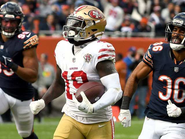 CHICAGO, ILLINOIS - OCTOBER 31: Deebo Samuel #19 of the San Francisco 49ers runs with the ball while being chased by DeAndre Houston-Carson #36 of the Chicago Bears in the third quarter at Soldier Field on October 31, 2021 in Chicago, Illinois.