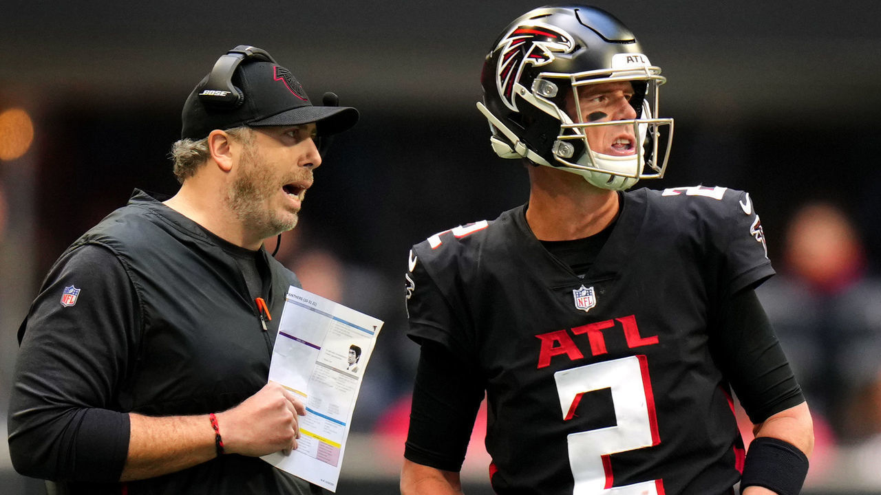 ATLANTA, GEORGIA - OCTOBER 31: Head coach Arthur Smith of the Atlanta Falcons and Matt Ryan #2 meet in the fourth quarter against the Carolina Panthers at Mercedes-Benz Stadium on October 31, 2021 in Atlanta, Georgia.