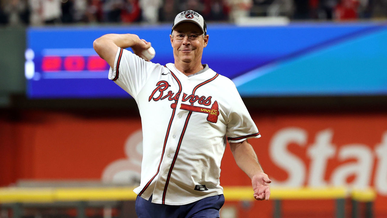 ATLANTA, GA - OCTOBER 31: Braves legend and Hall of Fame Greg Maddux throws the ceremonial first pitch before the start of Game 5 of the 2021 World Series between the Houston Astros and the Atlanta Braves at Truist Park on Sunday, October 31, 2021 in Atlanta, Georgia.
