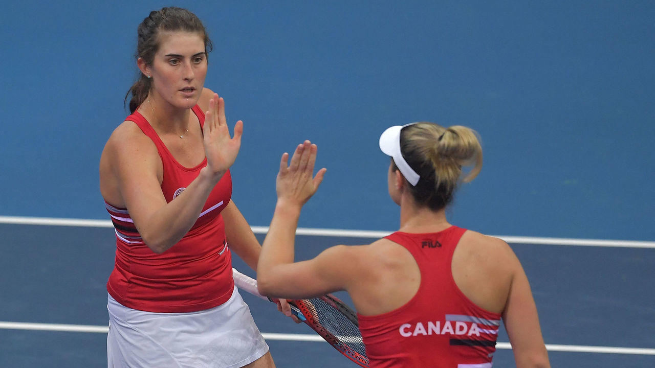 Rebecca Marino (L) and Gabriela Dabrowski of Canada react during their group match against Alize Cornet and Clarta Burel of France (Both unseen) during the Billie Jean King Cup finals between France and Canada on November 1, 2021 in Prague.