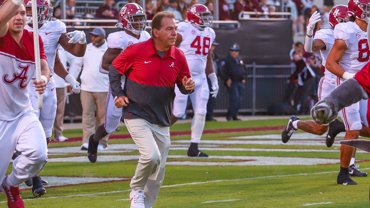 STARKVILLE, MS - OCTOBER 16: Alabama Crimson Tide head coach Nick Saban leads his team on to the field before the game between the Mississippi State Bulldogs and the Alabama Crimson Tide on October 16, 2021, at Davis Wade Stadium in Starkville, MS.
