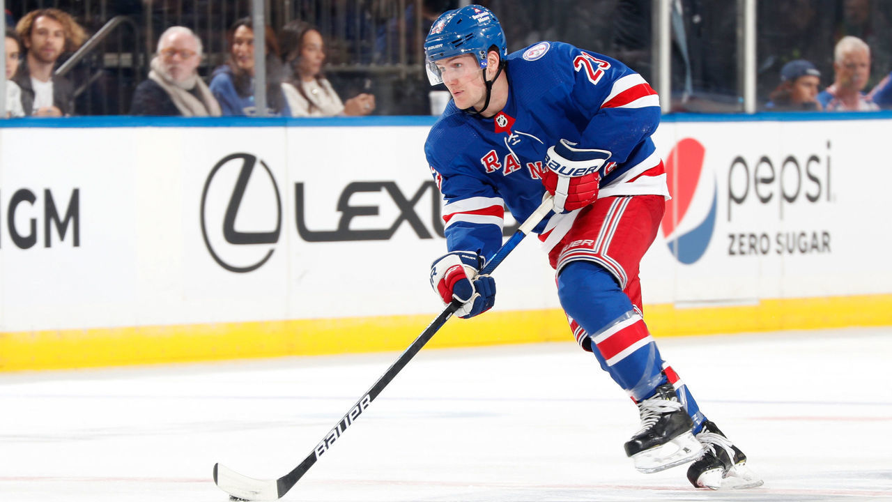 NEW YORK, NY - OCTOBER 25: Adam Fox #23 of the New York Rangers skates with the puck against the Calgary Flames at Madison Square Garden on October 25, 2021 in New York City.