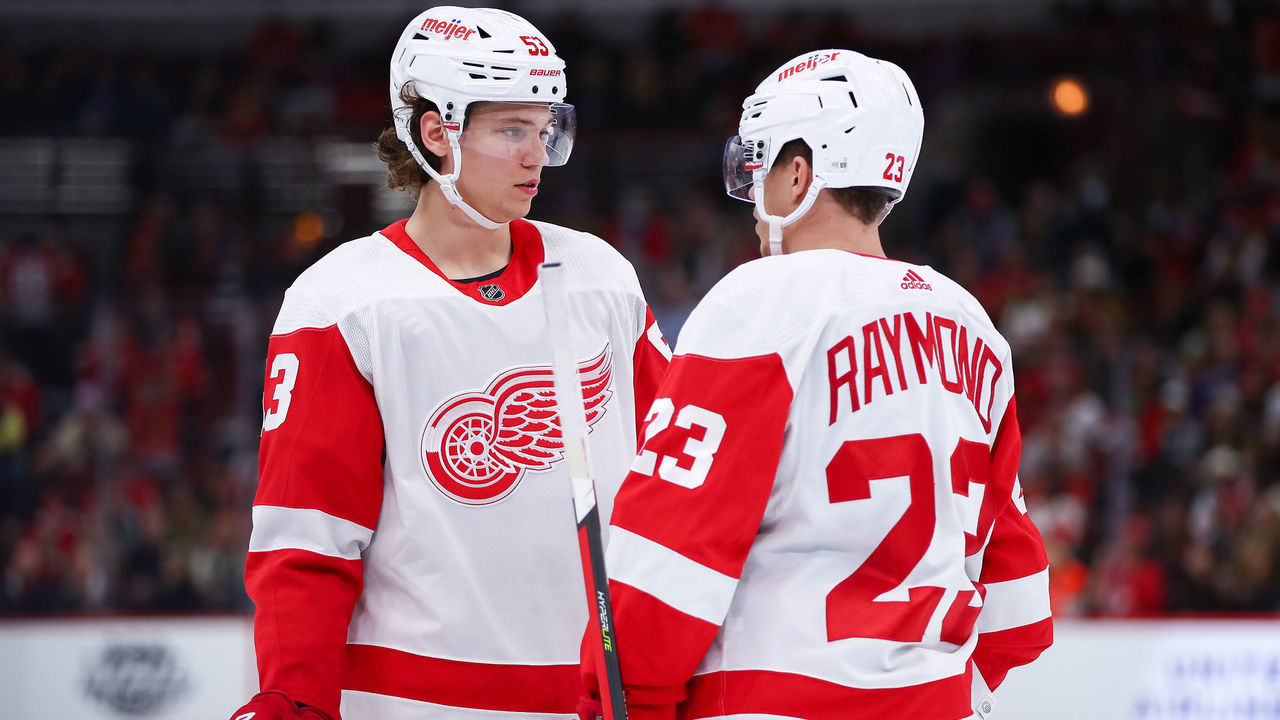 CHICAGO, IL - OCTOBER 24: Detroit Red Wings Defenceman Moritz Seider (53) talks with his teammate Detroit Red Wings Right Wing Lucas Raymond (23) during a game between the Chicago Blackhawks and the Detroit Red Wings on October 24, 2021 at the United Center in Chicago, IL.