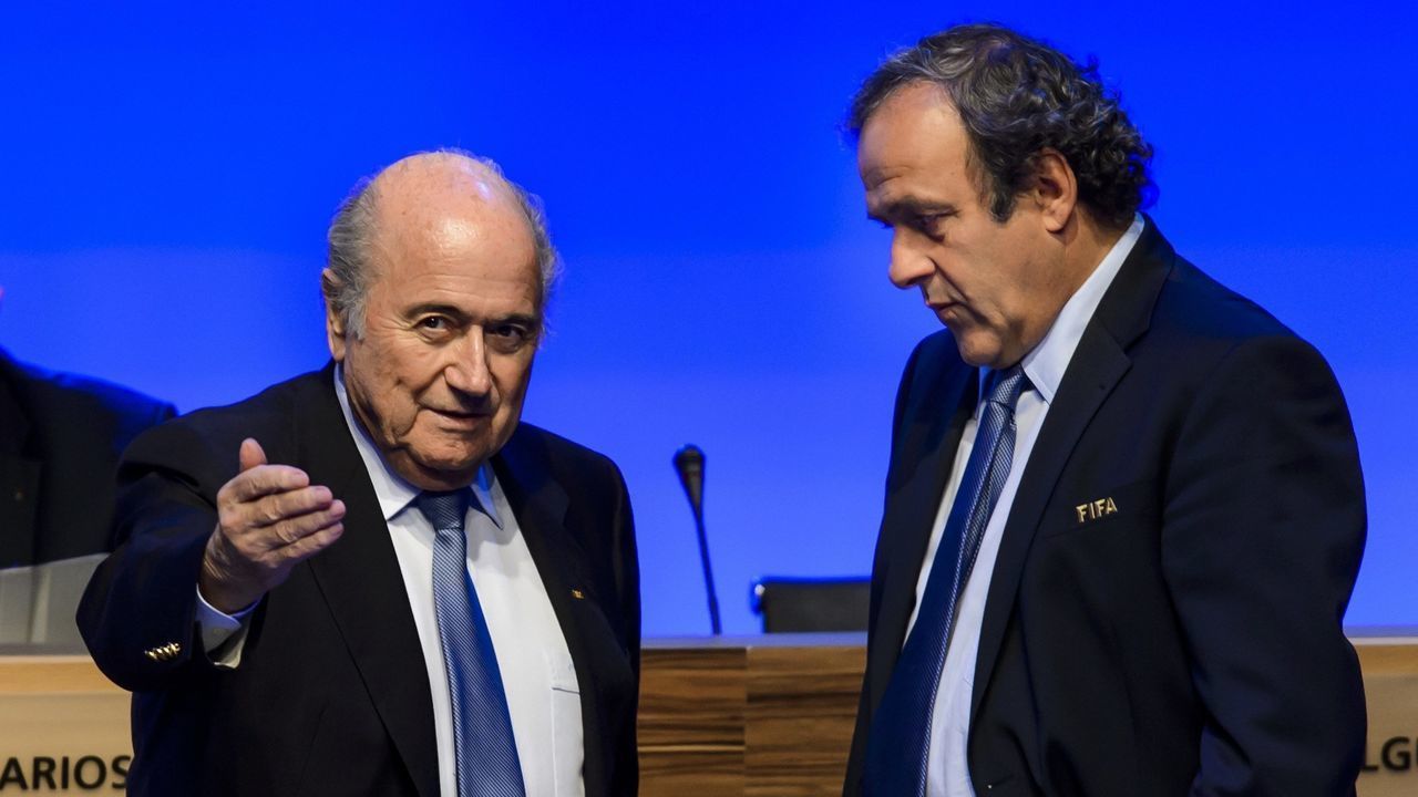 FIFA president Joseph Blatter (L) talks to UEFA president Michel Platini during the 64th FIFA congress on June 11, 2014 in Sao Paulo, on the eve of the opening match of the 2014 FIFA World Cup in Brazil. AFP PHOTO / FABRICE COFFRINI