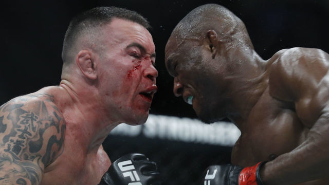 LAS VEGAS, NEVADA - DECEMBER 14: Colby Covington (L) battles with UFC welterweight champion Kamaru Usman in their title fight during UFC 245 at T-Mobile Arena on December 14, 2019 in Las Vegas, Nevada. Usman retained his title with a fifth-round TKO.