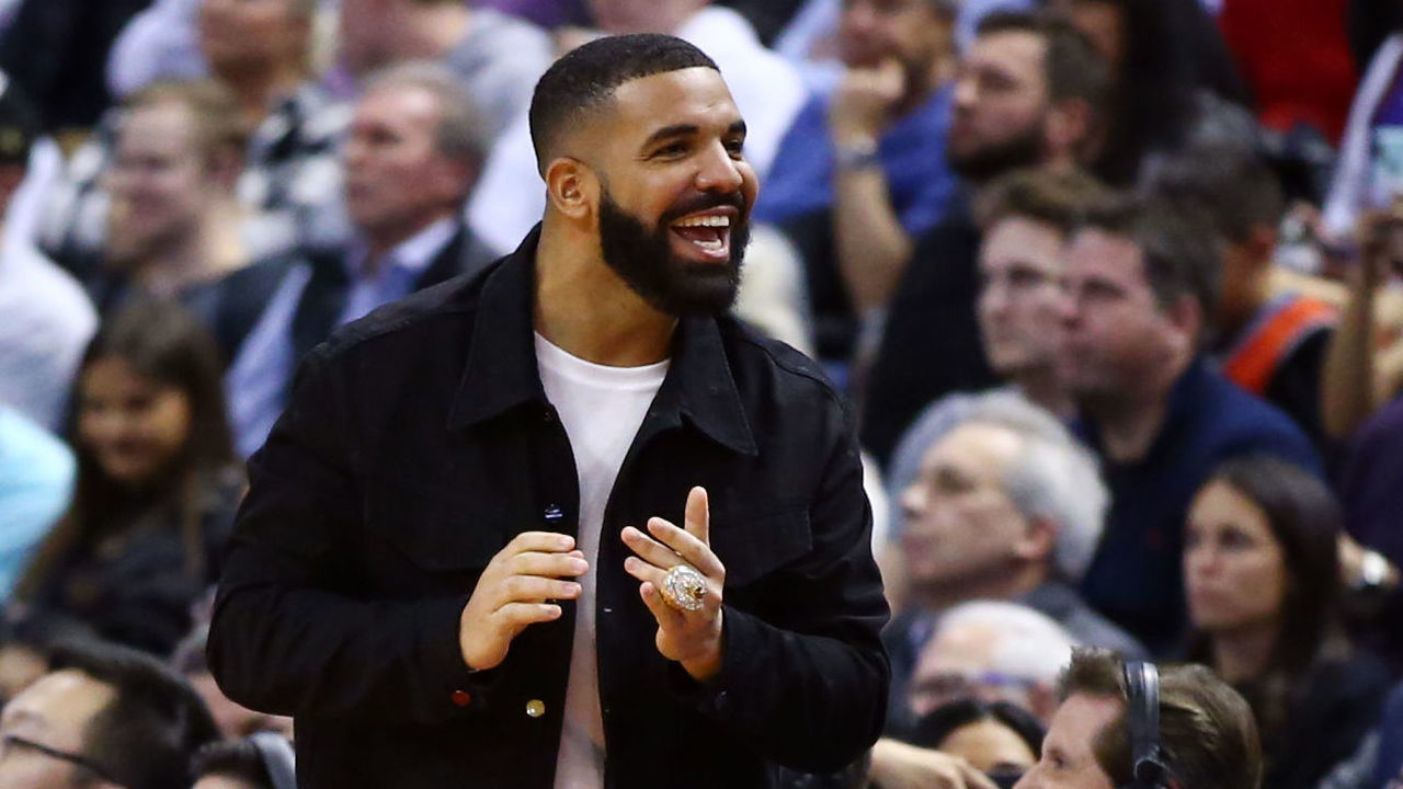 TORONTO, ON - NOVEMBER 25: Singer Drake shouts to Joel Embiid of the Philadelphia 76ers during the second half against the Toronto Raptors at Scotiabank Arena on November 25, 2019 in Toronto, Canada.