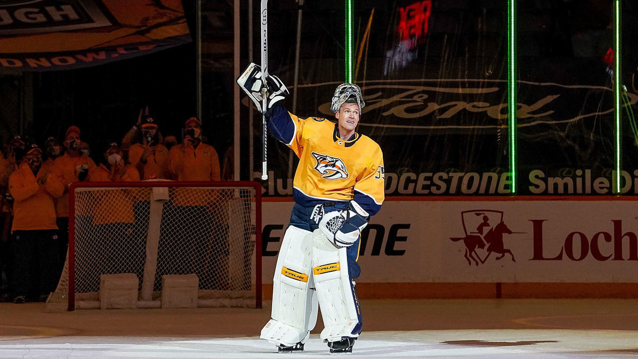 NASHVILLE, TN - MAY 10: Pekka Rinne #35 of the Nashville Predators is celebrated by his teammates and fans after a 5-0 win against the Carolina Hurricanes at Bridgestone Arena on May 10, 2021 in Nashville, Tennessee.